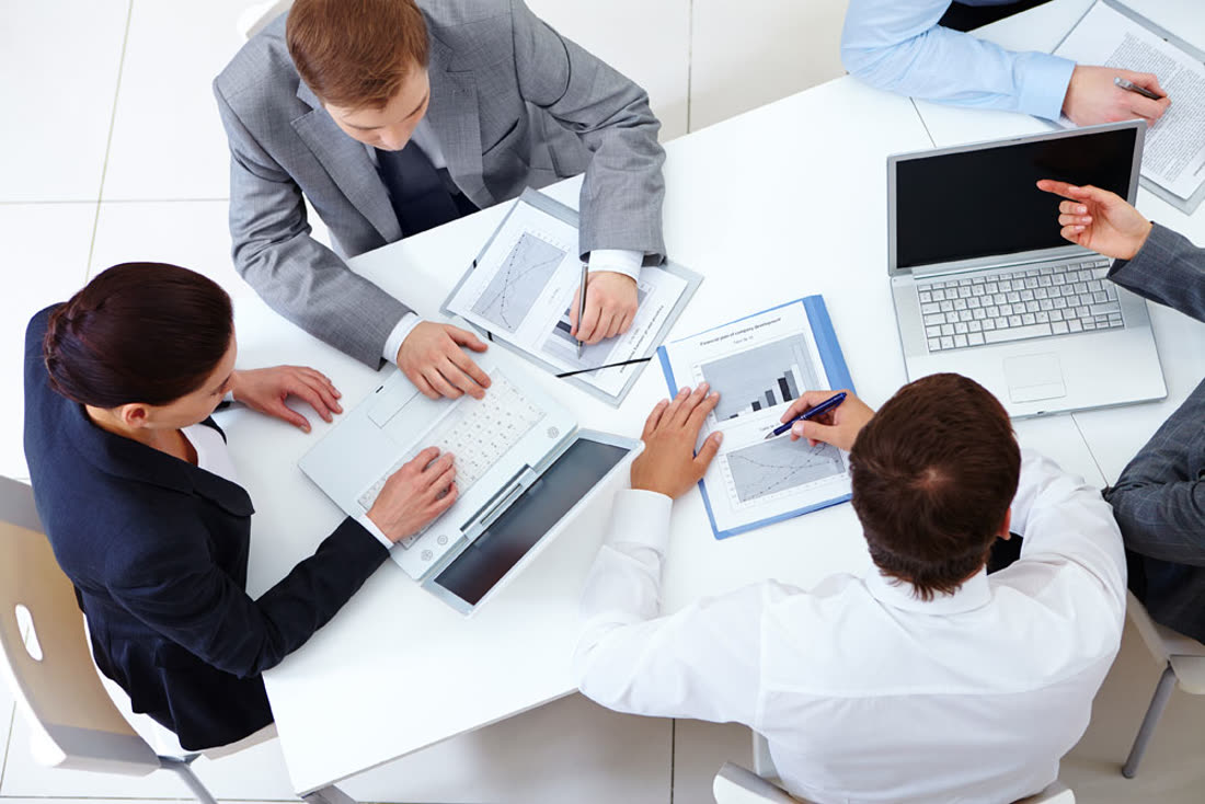 Team reviewing financial charts and figures together